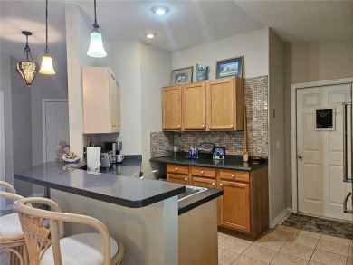 Move-ready 3 bedroom, 2 bath villa in Brentwood with 9 hole on Brentwood Farms Golf Club in Florida - for sale on GolfHomes.com, golf home, golf lot