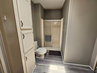This home is on leased land, meaning buyers do not own the land on Big Cypress Golf and Country Club in Florida - for sale on GolfHomes.com, golf home, golf lot