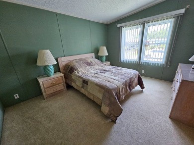 This home is on leased land, meaning buyers do not own the land on Big Cypress Golf and Country Club in Florida - for sale on GolfHomes.com, golf home, golf lot