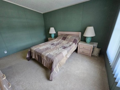 This home is on leased land, meaning buyers do not own the land on Big Cypress Golf and Country Club in Florida - for sale on GolfHomes.com, golf home, golf lot