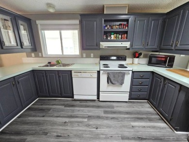 This home is on leased land, meaning buyers do not own the land on Big Cypress Golf and Country Club in Florida - for sale on GolfHomes.com, golf home, golf lot