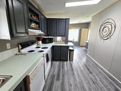 This home is on leased land, meaning buyers do not own the land on Big Cypress Golf and Country Club in Florida - for sale on GolfHomes.com, golf home, golf lot