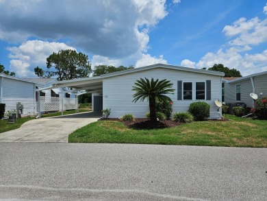 This home is on leased land, meaning buyers do not own the land on Big Cypress Golf and Country Club in Florida - for sale on GolfHomes.com, golf home, golf lot