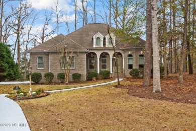 Welcome to your dream home! This immaculate custom brick home for sale on GolfHomes.com