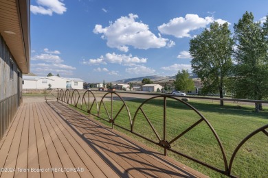 Experience maintenance-free living in this beautifully remodeled on Antelope Hills Golf Course in Wyoming - for sale on GolfHomes.com, golf home, golf lot