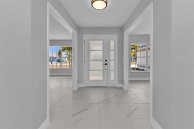 Welcome to 2247 Hamburg Ln, a beautifully renovated 4-bedroom on Deep Creek Golf Club in Florida - for sale on GolfHomes.com, golf home, golf lot