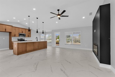 Welcome to 2247 Hamburg Ln, a beautifully renovated 4-bedroom on Deep Creek Golf Club in Florida - for sale on GolfHomes.com, golf home, golf lot