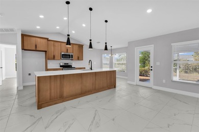 Welcome to 2247 Hamburg Ln, a beautifully renovated 4-bedroom on Deep Creek Golf Club in Florida - for sale on GolfHomes.com, golf home, golf lot