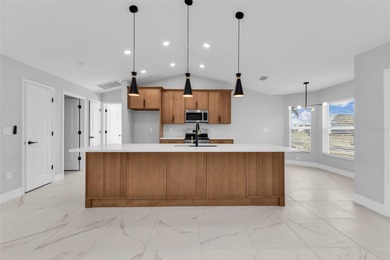 Welcome to 2247 Hamburg Ln, a beautifully renovated 4-bedroom on Deep Creek Golf Club in Florida - for sale on GolfHomes.com, golf home, golf lot