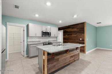 LAKEFRONT 5-bedroom, 3-bathroom, 2-car garage, concrete block on Venetian Bay Golf Course in Florida - for sale on GolfHomes.com, golf home, golf lot