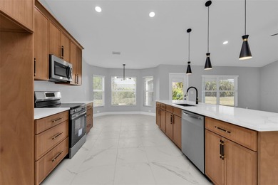 Welcome to 2247 Hamburg Ln, a beautifully renovated 4-bedroom on Deep Creek Golf Club in Florida - for sale on GolfHomes.com, golf home, golf lot