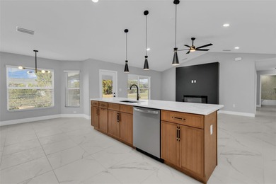 Welcome to 2247 Hamburg Ln, a beautifully renovated 4-bedroom on Deep Creek Golf Club in Florida - for sale on GolfHomes.com, golf home, golf lot