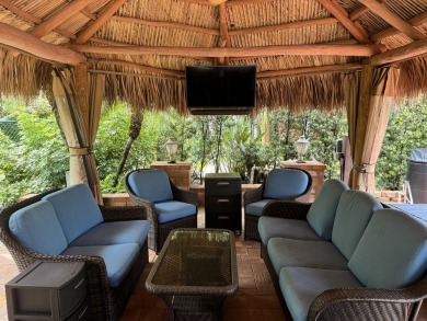 Beautiful landscaped . Large granite bar for wonderful outdoor on St. Lucie Trail Golf Club in Florida - for sale on GolfHomes.com, golf home, golf lot