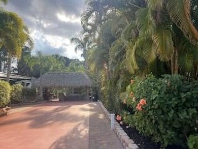 Beautiful landscaped . Large granite bar for wonderful outdoor on St. Lucie Trail Golf Club in Florida - for sale on GolfHomes.com, golf home, golf lot