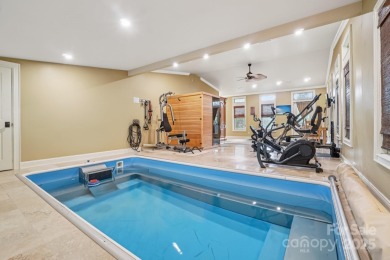 Hollywood glam meets the mountains at 193 Gateway Drive in on Rumbling Bald Resort on Lake Lure in North Carolina - for sale on GolfHomes.com, golf home, golf lot