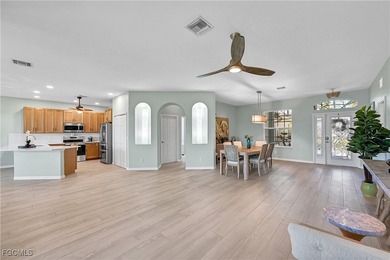 Nestled in the prestigious gated Herons Glen Golf & Country Club on Herons Glen Golf and Country Club in Florida - for sale on GolfHomes.com, golf home, golf lot