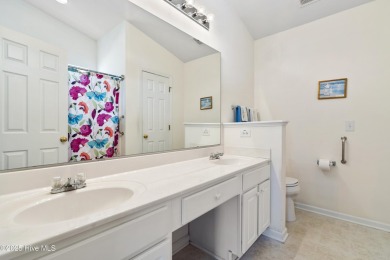 Welcome to this charming and well-appointed single-story home on Crow Creek Golf Club in North Carolina - for sale on GolfHomes.com, golf home, golf lot