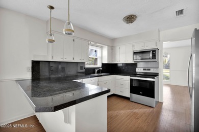 Check out this delightful home with super curb appeal in on Blue Cypress Golf Club in Florida - for sale on GolfHomes.com, golf home, golf lot