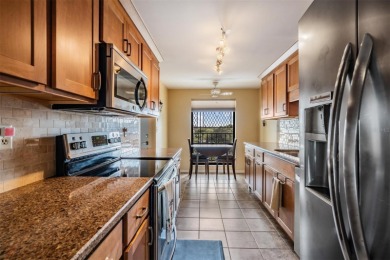 The view truly takes the cake in this stunning top-floor condo on Cove Cay Country Club in Florida - for sale on GolfHomes.com, golf home, golf lot