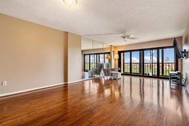 The view truly takes the cake in this stunning top-floor condo on Cove Cay Country Club in Florida - for sale on GolfHomes.com, golf home, golf lot