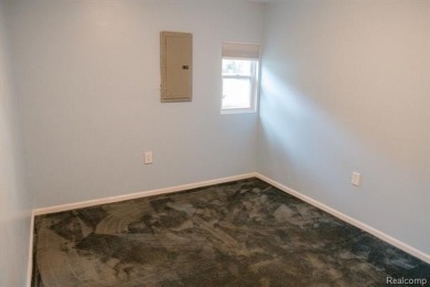 What an amazing opportunity to own an affordable home in on Edgewood Country Club in Michigan - for sale on GolfHomes.com, golf home, golf lot