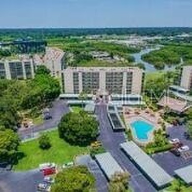 The view truly takes the cake in this stunning top-floor condo on Cove Cay Country Club in Florida - for sale on GolfHomes.com, golf home, golf lot