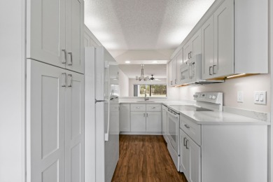 Beautiful and spacious first-floor 2 bedroom, 2 bath condo on The Golf Club of Jupiter in Florida - for sale on GolfHomes.com, golf home, golf lot