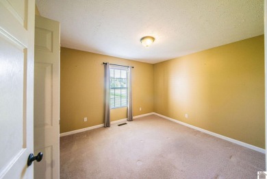 This welcoming 3-bedroom, 2-bath home sits on just over an acre on Paxton Park Golf Course in Kentucky - for sale on GolfHomes.com, golf home, golf lot