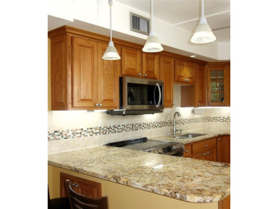 Your dream home with sweeping golf course and pond views! This on Palm-Aire Country Club and Resort - Palms in Florida - for sale on GolfHomes.com, golf home, golf lot