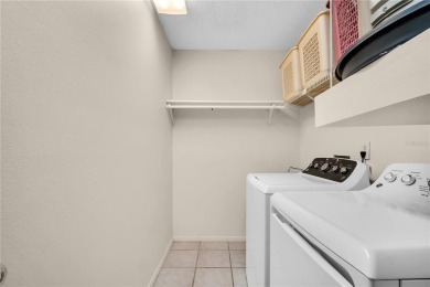 This spacious end-unit villa with serene golf course views is on Highland Lakes Executive Golf Course in Florida - for sale on GolfHomes.com, golf home, golf lot