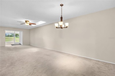 This spacious end-unit villa with serene golf course views is on Highland Lakes Executive Golf Course in Florida - for sale on GolfHomes.com, golf home, golf lot