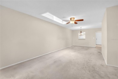 This spacious end-unit villa with serene golf course views is on Highland Lakes Executive Golf Course in Florida - for sale on GolfHomes.com, golf home, golf lot