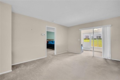 This spacious end-unit villa with serene golf course views is on Highland Lakes Executive Golf Course in Florida - for sale on GolfHomes.com, golf home, golf lot