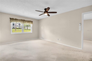 This spacious end-unit villa with serene golf course views is on Highland Lakes Executive Golf Course in Florida - for sale on GolfHomes.com, golf home, golf lot