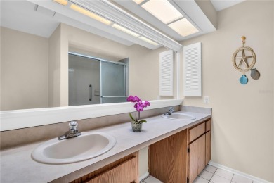 This spacious end-unit villa with serene golf course views is on Highland Lakes Executive Golf Course in Florida - for sale on GolfHomes.com, golf home, golf lot