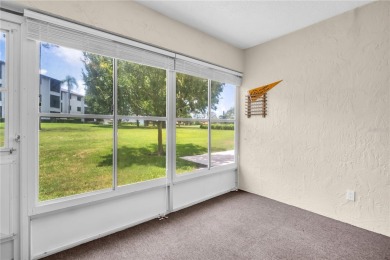 This spacious end-unit villa with serene golf course views is on Highland Lakes Executive Golf Course in Florida - for sale on GolfHomes.com, golf home, golf lot