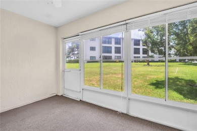 This spacious end-unit villa with serene golf course views is on Highland Lakes Executive Golf Course in Florida - for sale on GolfHomes.com, golf home, golf lot