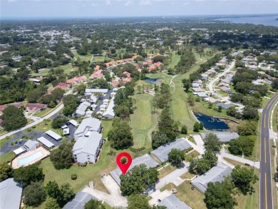 This spacious end-unit villa with serene golf course views is on Highland Lakes Executive Golf Course in Florida - for sale on GolfHomes.com, golf home, golf lot