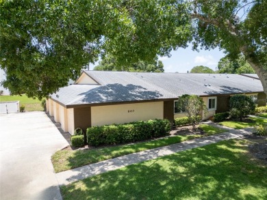 This spacious end-unit villa with serene golf course views is on Highland Lakes Executive Golf Course in Florida - for sale on GolfHomes.com, golf home, golf lot
