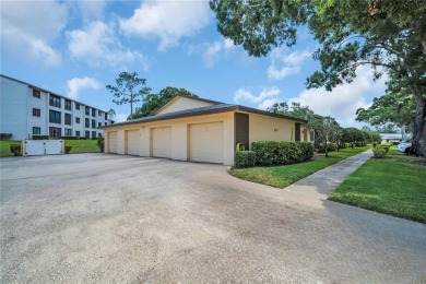 This spacious end-unit villa with serene golf course views is on Highland Lakes Executive Golf Course in Florida - for sale on GolfHomes.com, golf home, golf lot