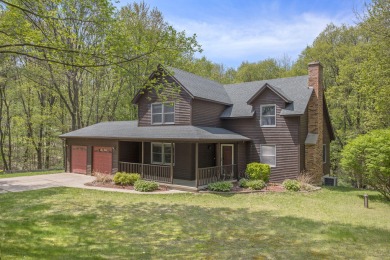 This 4 bed, 2.5 bath home sits on 5 wooded private acres in Gull on Yarrow Golf and Conference Center in Michigan - for sale on GolfHomes.com, golf home, golf lot