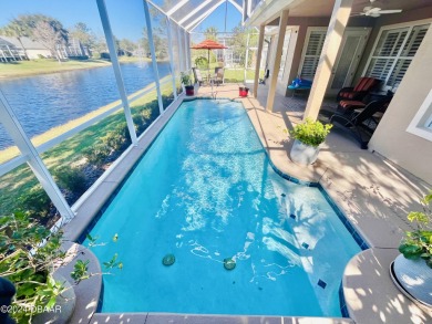 Unwind by the pool in your Plantation Bay Oasis! Escape the on Plantation Bay Golf and Country Club in Florida - for sale on GolfHomes.com, golf home, golf lot