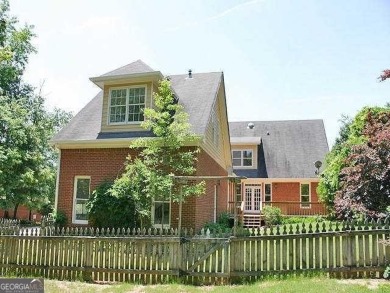 Charming 5 bedroom/4.5 bath Cape Cod-style home in Snellville's on Country Club of Gwinnett in Georgia - for sale on GolfHomes.com, golf home, golf lot