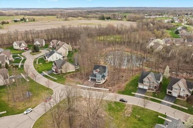 Discover the epitome of modern luxury in this move-in ready new on The Captains Club At Woodfield in Michigan - for sale on GolfHomes.com, golf home, golf lot