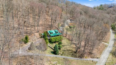 Escape to the mountains in this gorgeous 3BR/2BA, 1,900 sq ft on Wolf Laurel Country Club in North Carolina - for sale on GolfHomes.com, golf home, golf lot