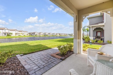 You'll love coming home to this stunning 2023-built waterfront on Venetian Bay Golf Course in Florida - for sale on GolfHomes.com, golf home, golf lot