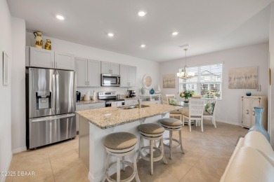 You'll love coming home to this stunning 2023-built waterfront on Venetian Bay Golf Course in Florida - for sale on GolfHomes.com, golf home, golf lot