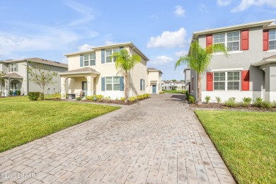 You'll love coming home to this stunning 2023-built waterfront on Venetian Bay Golf Course in Florida - for sale on GolfHomes.com, golf home, golf lot