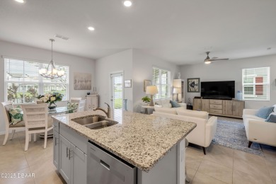 You'll love coming home to this stunning 2023-built waterfront on Venetian Bay Golf Course in Florida - for sale on GolfHomes.com, golf home, golf lot