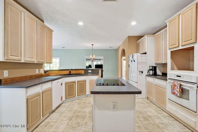 This spacious, 4-bedroom home offers an open floor plan for the on Carolina Shores Golf Course in North Carolina - for sale on GolfHomes.com, golf home, golf lot